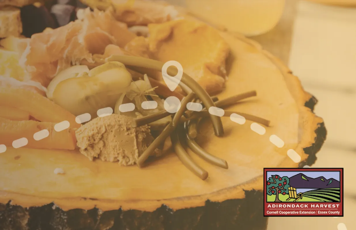 An image of a picnic on a wooden plate.